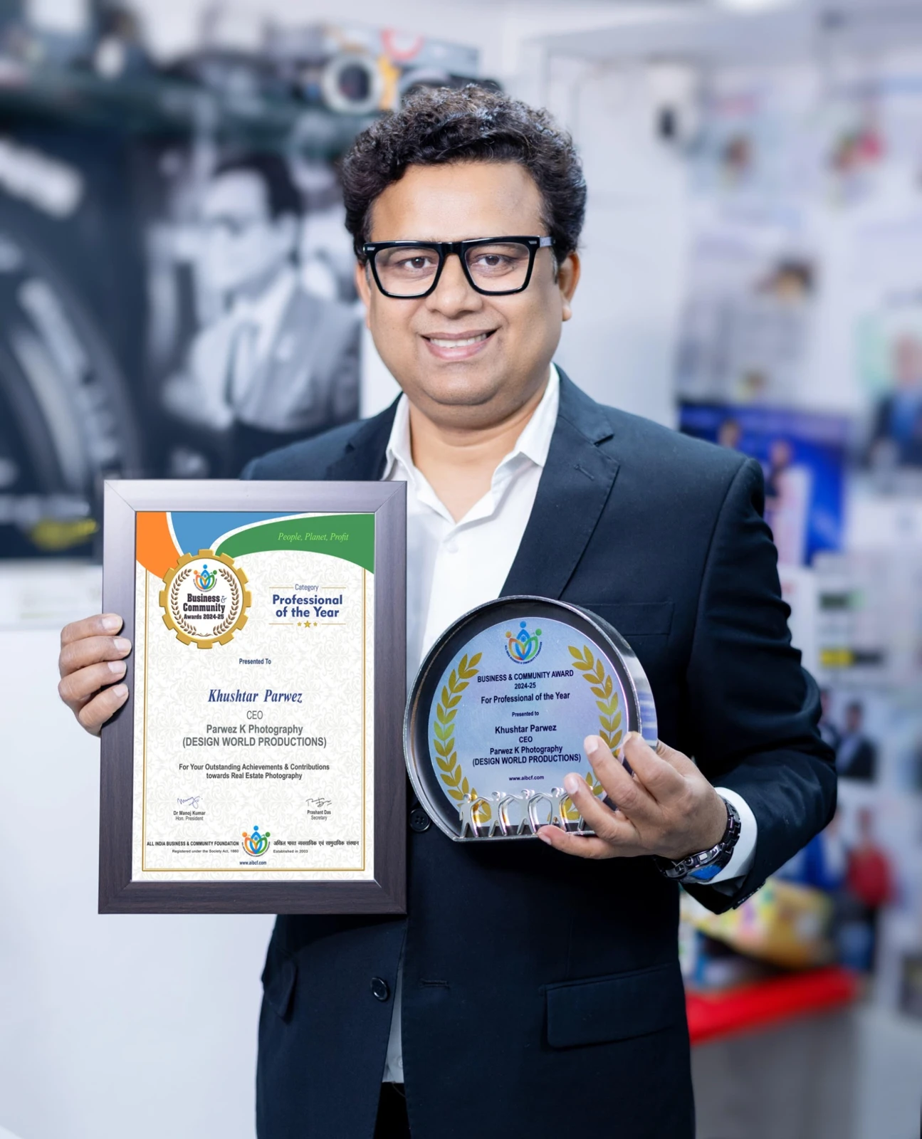Khushtar Parwez holding his Professional of the Year certificate and award